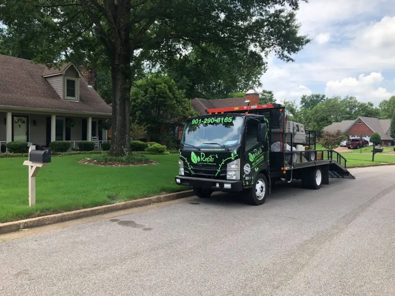Roper Lawn & Landscape crew truck and trailer