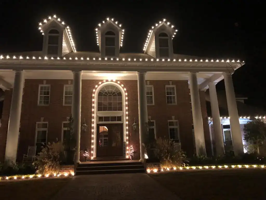 Porch columns with holiday lighting by Roper